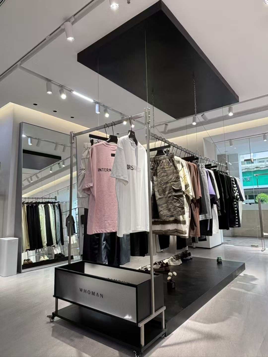 Garment island and integrated storage in an apparel store