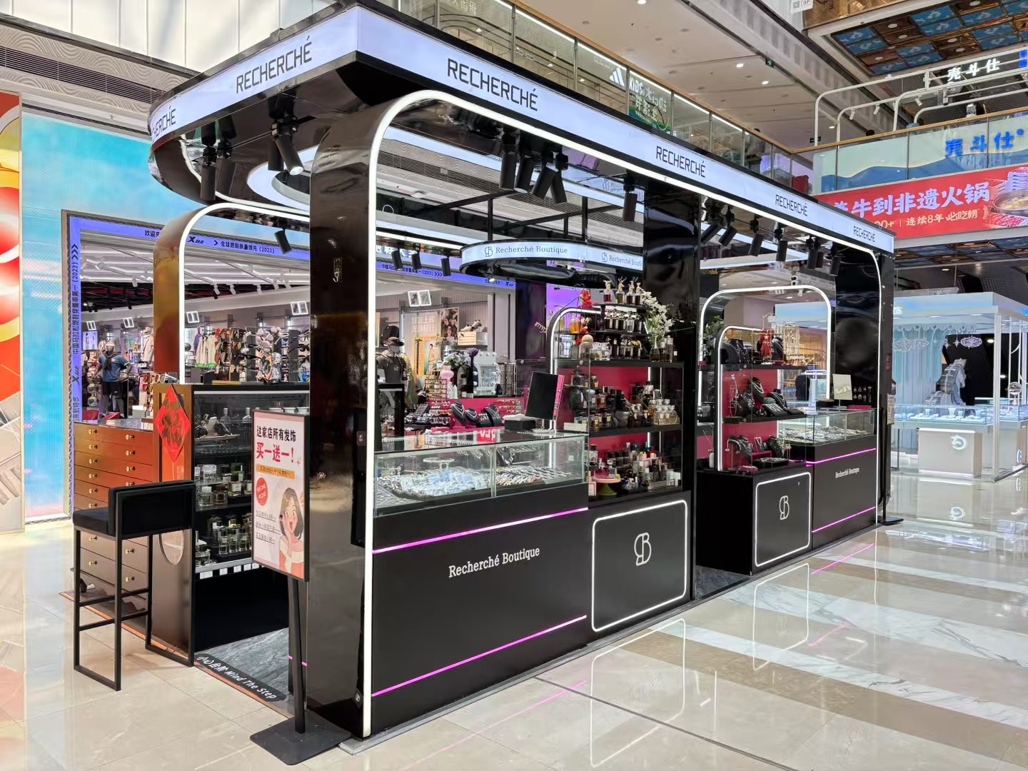 Black metal canopy and glass display counters in a retail kiosk